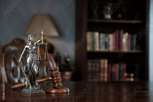 Lawyers office concept. Law symbols composition: gavel, scale and Themis statue.