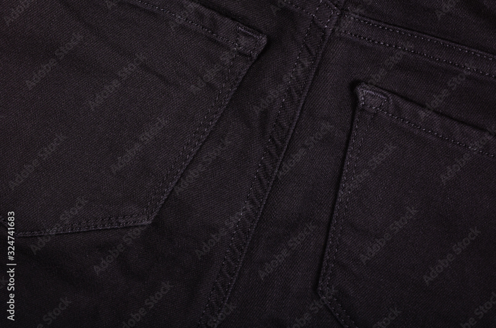 Black cotton jeans texture background with copy space. Black cotton jeans texture background with copy space.