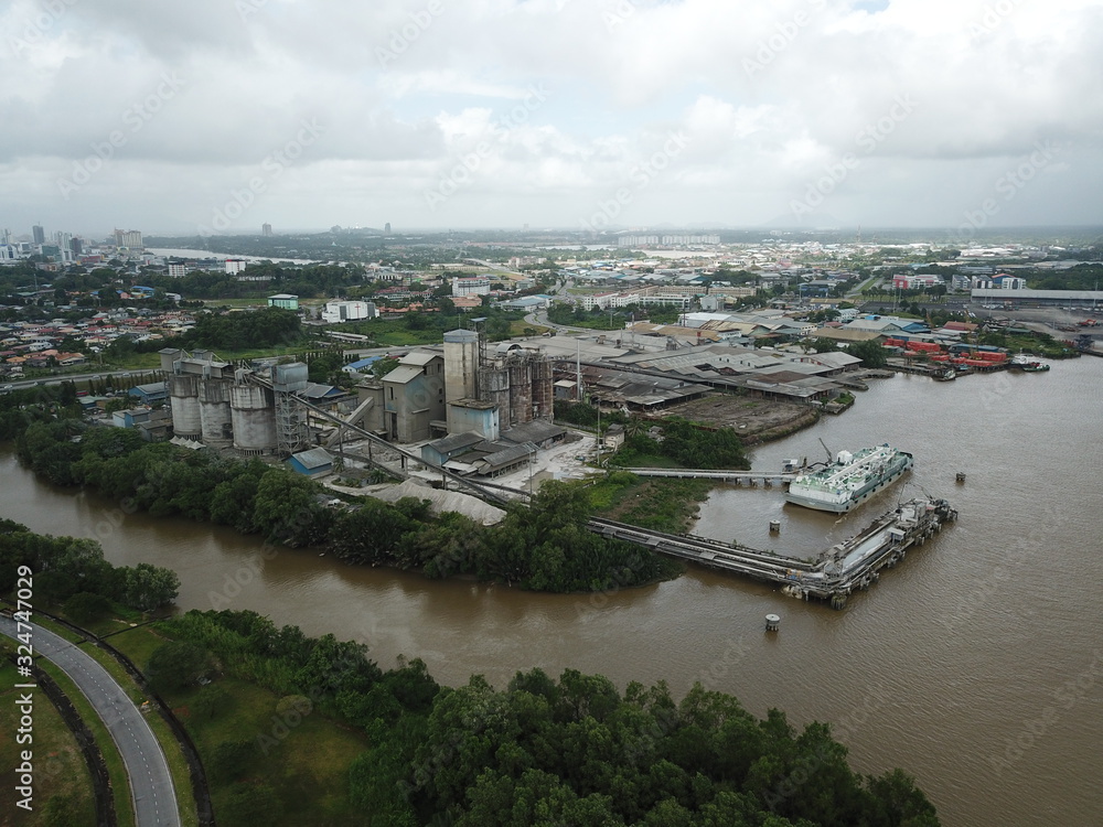 Fototapeta premium Kuching, Sarawak / Malaysia - February 21, 2020: The CMS Cement Industrial Plant and Factory at the Muara Tabuan area
