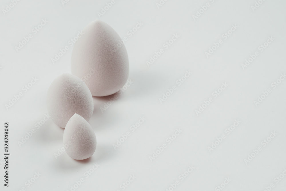 Small, medium and large white beauty blender isolated. Small, medium and large white beauty blender isolated.