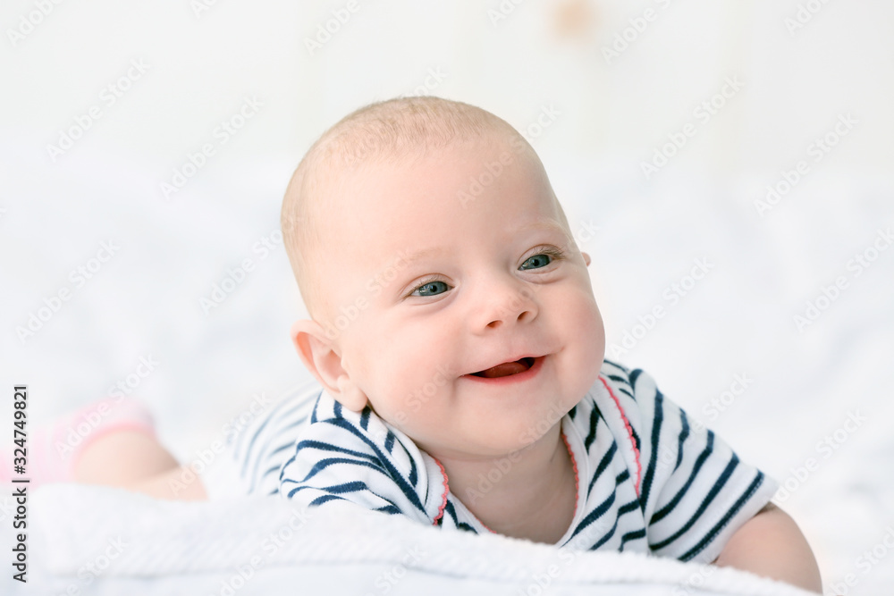 Portrait of cute little baby lying on bed Portrait of cute little baby lying on bed
