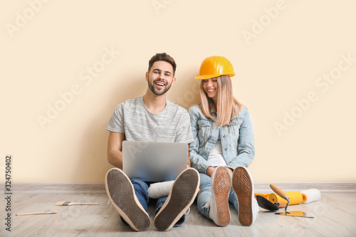 Young couple with laptop pl...