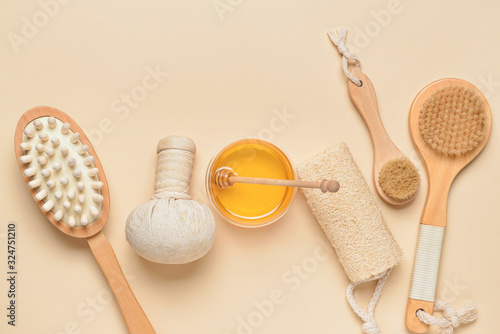 Composition with spa items and honey on color background