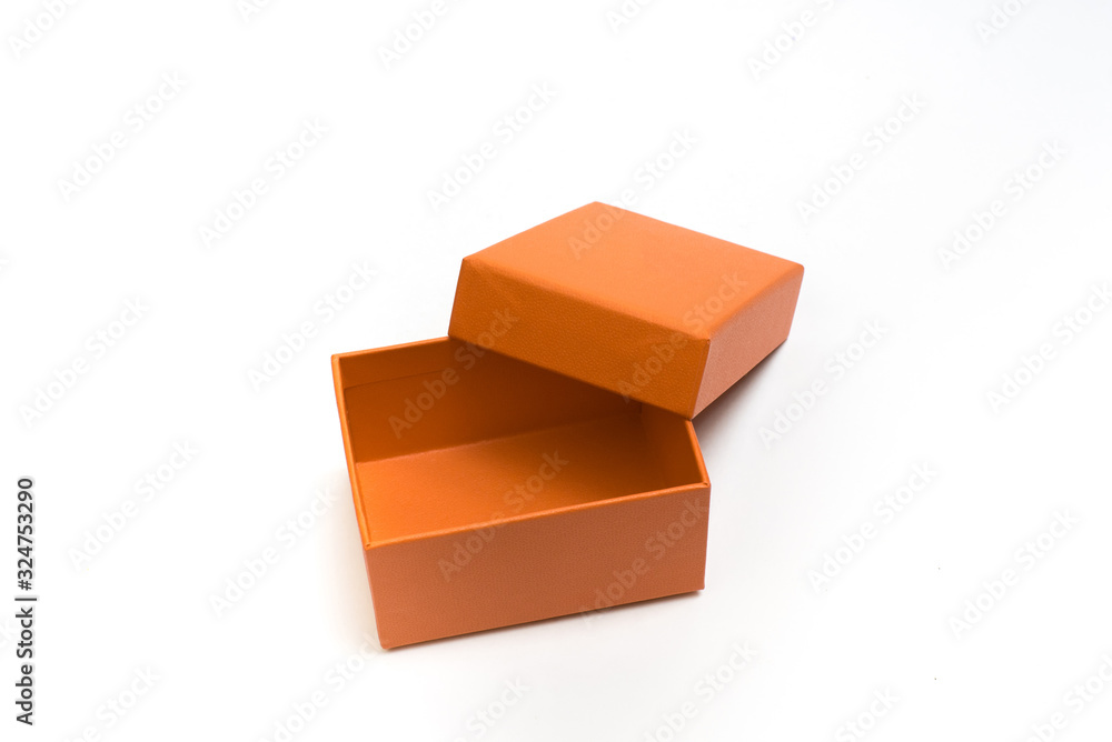 Orange open empty box with a lid on a white background. Packaging. Gift.