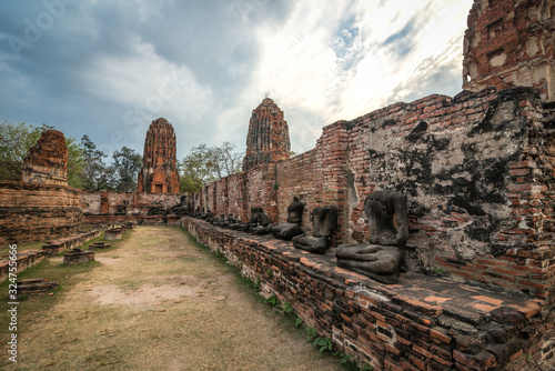 The scenery of the Wat Mahathat temple in cloudy day in Ayutthaya, Thailand.