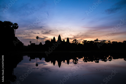 Reflection of an Angkor Wat in silhouette look in Siem Reap, Cambodia.