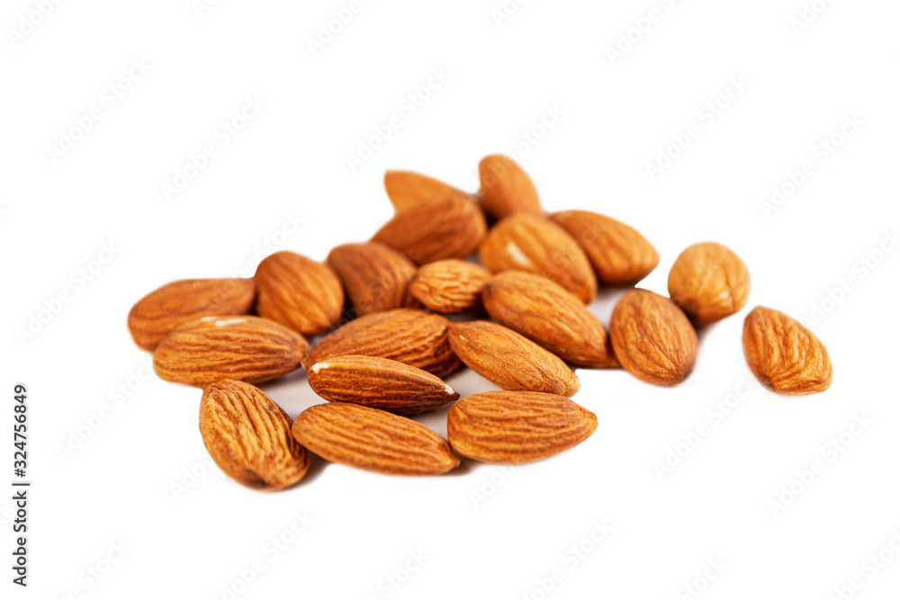 A handful of mouth-watering almonds. Health and proper nutrition. Isolated on a white background. Close-up. A handful of mouth-watering almonds. Health and proper nutrition. Isolated on a white background. Close-up.