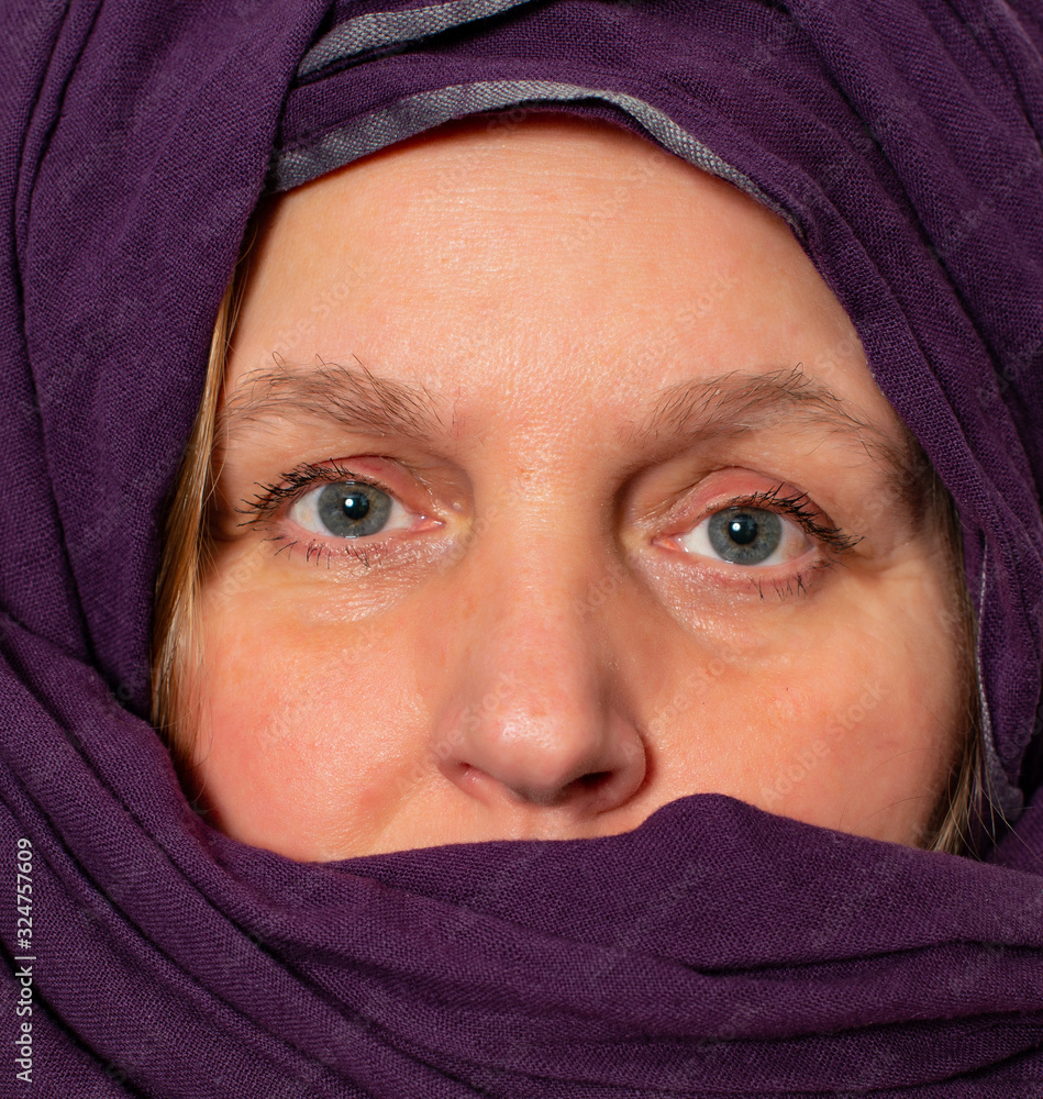 Model with beautiful eyes has a turban around her face Model with beautiful eyes has a turban around her face