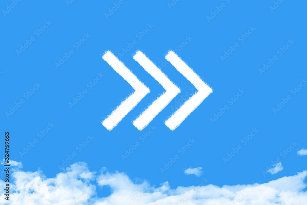 Arrow shaped cloud on blue sky Arrow shaped cloud on blue sky