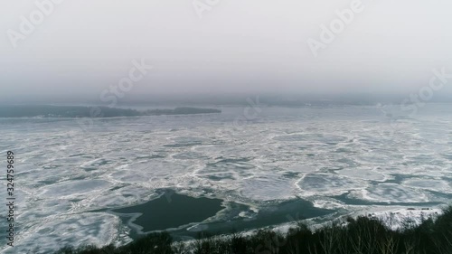 Spring Ice Drift on the River on a Cloudy Day. 30 seconds. Great background your project. 4K 3840x2160 UHD