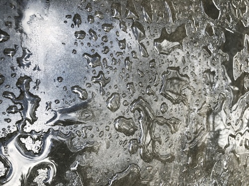 Water drops from the rain on the gray surface of the table © Ekati