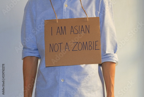 Tableau sur toile Closeup cardboard sign hanging on a protester neck contains handwriting message