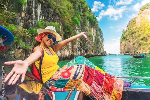 Happy traveler Asian woman in summer dress joy fun relaxing on boat at Pileh lagoon Krabi, Leisure tourist travel Phuket Thailand summer holiday vacation trip, Tourism beautiful destination place Asia