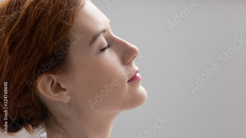 Close up businesswoman relaxing with closed eyes, stress relief