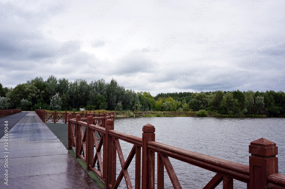 Fototapeta premium wooden bridge over the lake