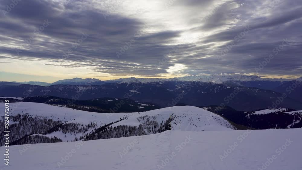 Panning view of snow capped winter alps just before sunset from the ski resort area near Merano, Italy Panning view of snow capped winter alps just before sunset from the ski resort area near Merano, Italy
