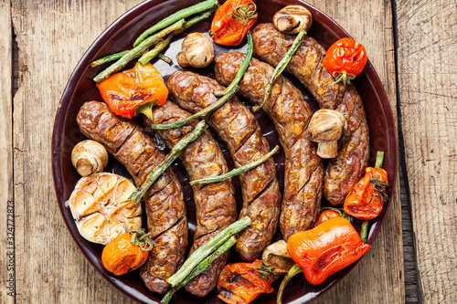Sausages fried with vegetable