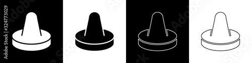 Set Mallet and puck for playing air hockey game icon isolated on black and white background. Vector Illustration