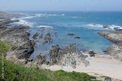 beautiful bay in schoenmakerskop port elizabeth in calm conditions and small waves photo