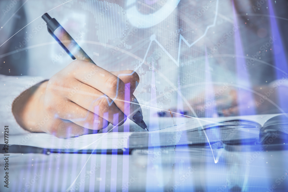 Multi exposure of woman's hands making notes with forex graph hologram. Concept stock market analysis. Multi exposure of woman's hands making notes with forex graph hologram. Concept stock market analysis.