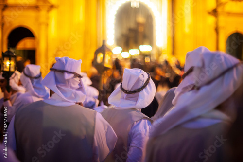 Christian brethren during the traditional Good Friday procession, Leonforte