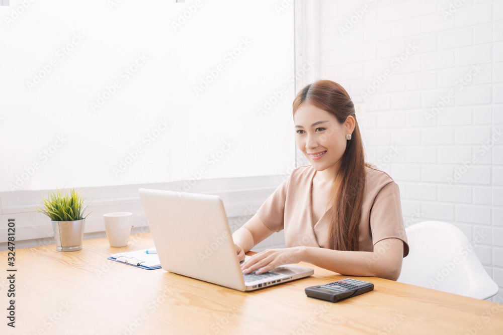 Asian young businessman working with laptop in coffee shop cafe while drinking coffee ,technology or startup business concept, modern office or living room with copy space Asian young businessman working with laptop in coffee shop cafe while drinking coffee ,technology or startup business concept, modern office or living room with copy space
