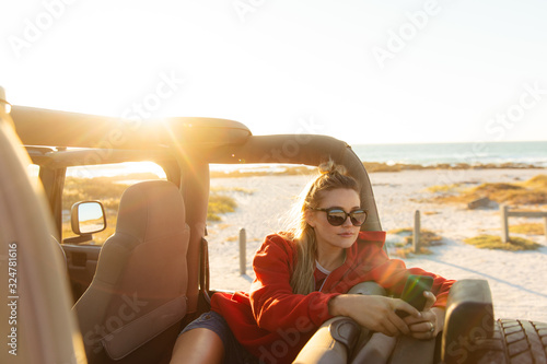Woman with car enjoying free time