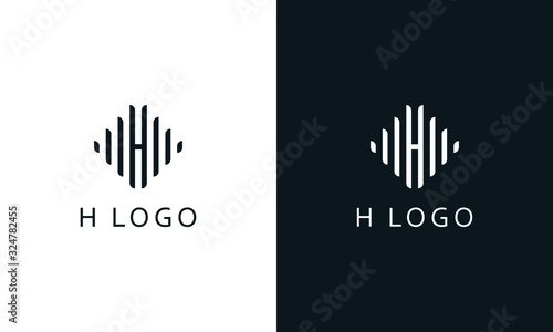 Minimalist elegant line art letter H logo. This logo icon incorporate with lots of line and brand name in the creative way. photo