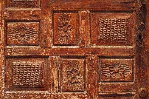 Fragment of a wooden antique door. The streets of Turkey. Background photo.