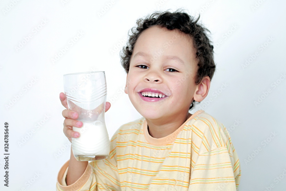 child drinking milk for breakfast on white background stock photo child drinking milk for breakfast on white background stock photo