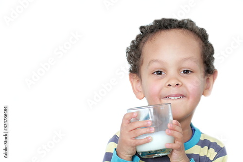 child drinking milk for breakfast on white background stock photo