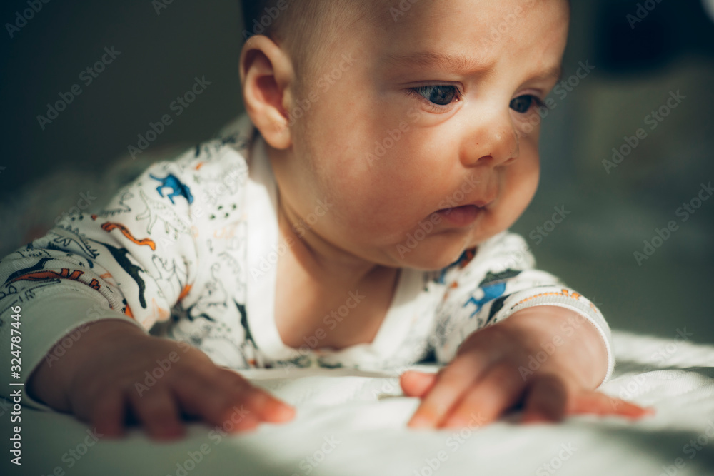 Newborn portrait baby boy learning light Newborn portrait baby boy learning light