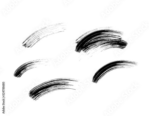 Mascara eyelashes brush stroke set isolated on white background. Vector black hand drawn lash scribble texture swatch for fashion cosmetic makeup design.