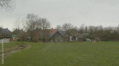 Small farming town in the province of Groningen in the North of the Netherlands - medium shot photo