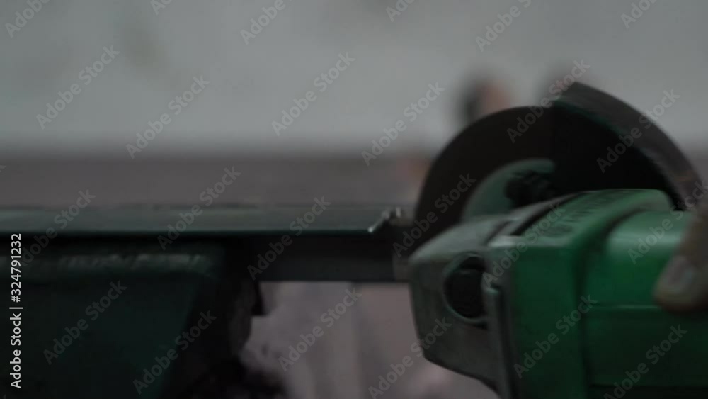 Worker with Angle Grinder does Metalworking in Industrial Environment. Worker with Angle Grinder does Metalworking in Industrial Environment.