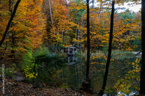 Autumn landscape with a house and a lake; Turtle lake in autumn Yalta Crimea