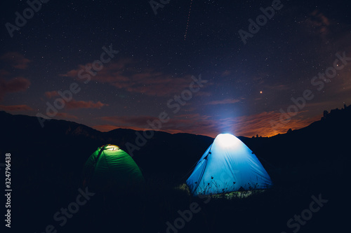 Fototapeta Naklejka Na Ścianę i Meble -  Tents in the night with the milky way.  Wanderlust and travel concept. 