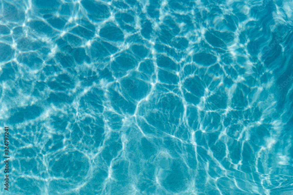 Beautiful refreshing blue swimming pool water. Background of blue water in the pool Beautiful refreshing blue swimming pool water. Background of blue water in the pool