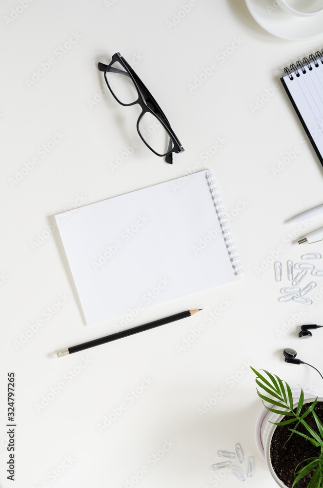 Workspace with pen, paper, coffee cup and office supplies. Workspace with pen, paper, coffee cup and office supplies.