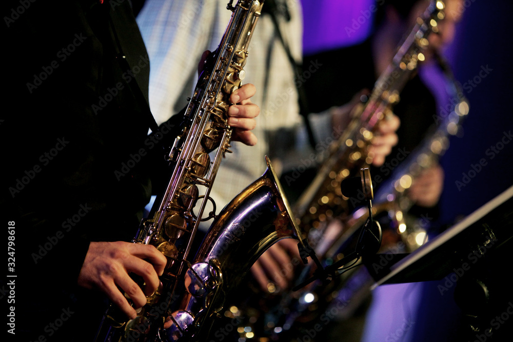 Obraz premium Jazz saxophone performance on the stage detail