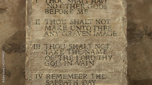 10 Commandments from the Bible which God tells Moses to write the Ten rules on Tablets of stone. Tilt shot - Stock Video Clip Footage photo