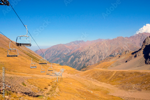 Empty ski-lift in summer in mountains. Ropeway, cable-car.