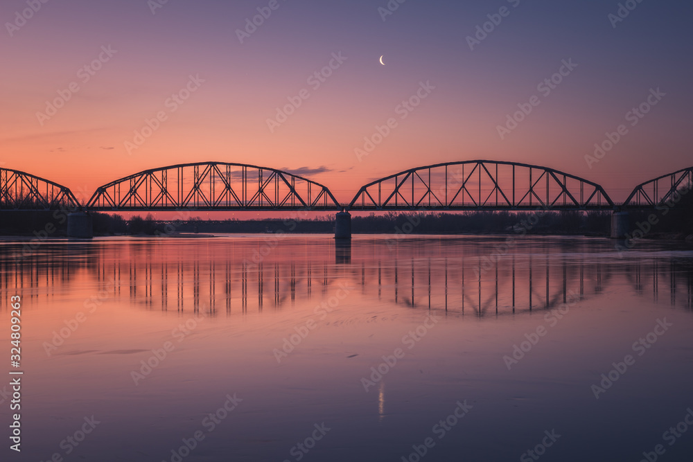 Trailway bridge over the Vistula river at night in Gora Kalwaria, Poland