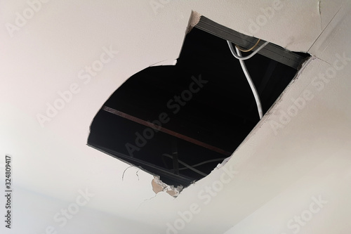 Rain water leaks on the ceiling causing damage, tiles and gypsum board.