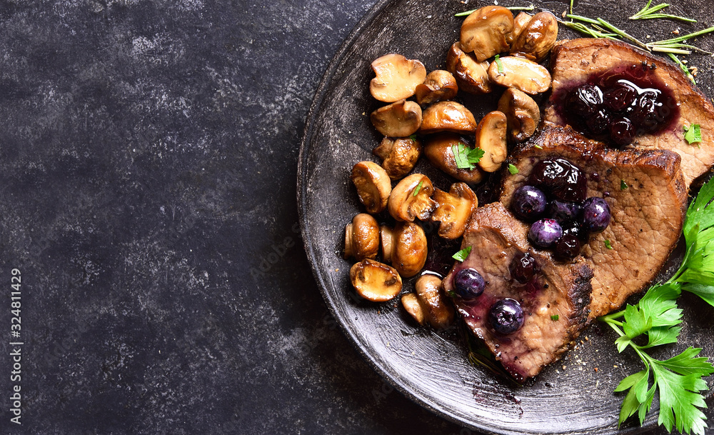 Beef with mushrooms and blueberry sauce Beef with mushrooms and blueberry sauce