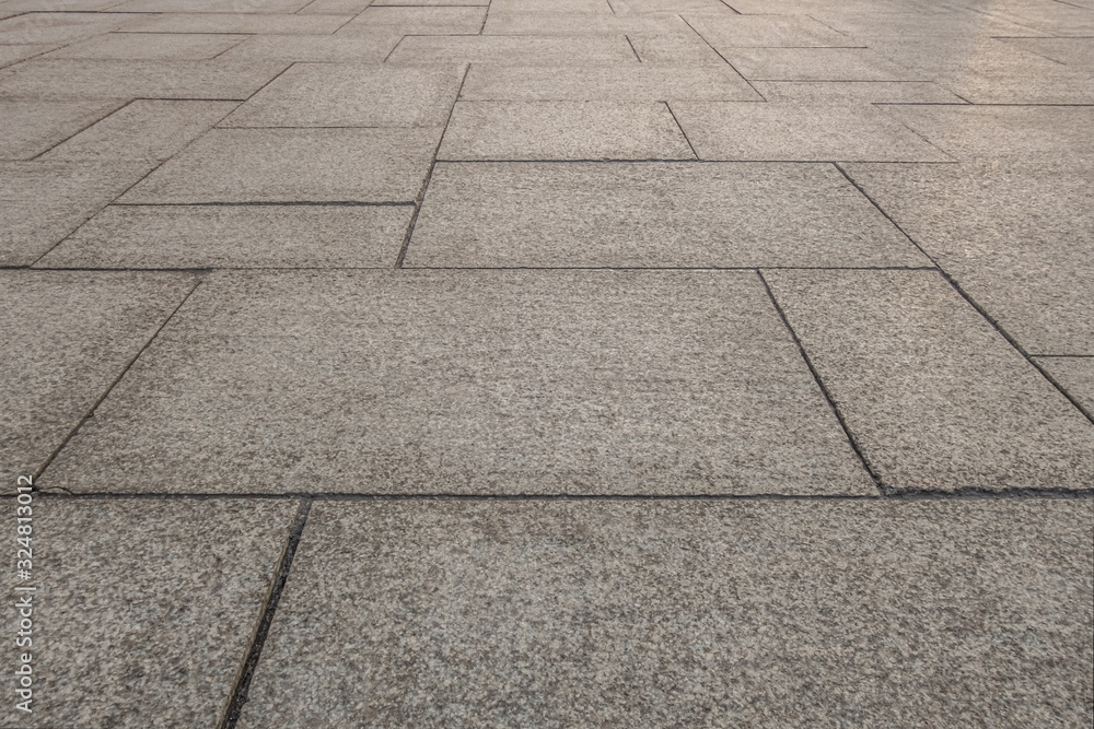 abstract background of the pavement lined with granite slabs