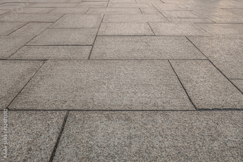 abstract background of the pavement lined with granite slabs