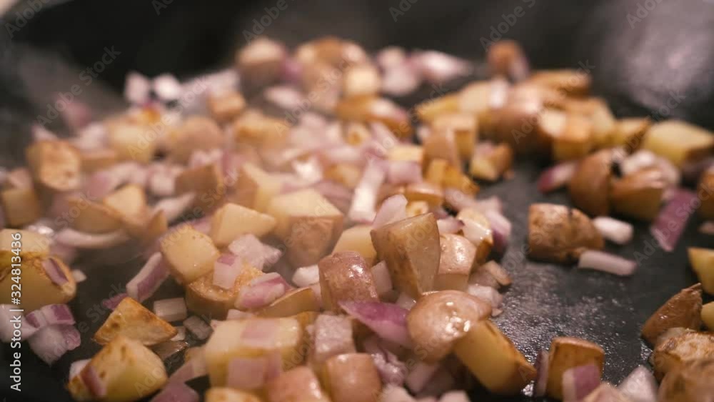 Vegetables cooking in a frying pan in slow motion Vegetables cooking in a frying pan in slow motion