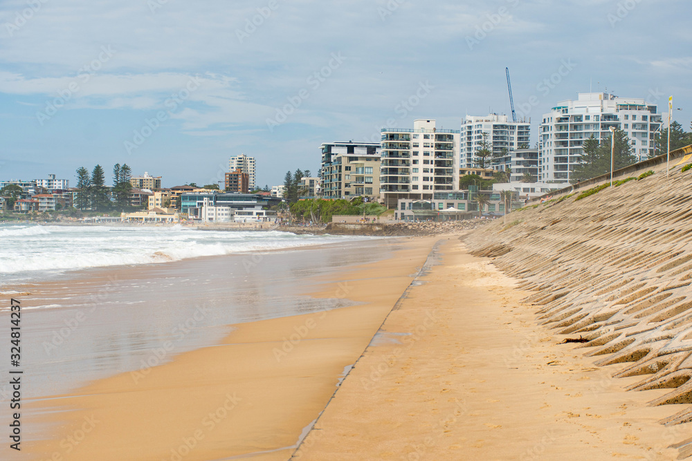 Beatiful empty urban beach in Sydney, Australia. Concrete basement exposed at North Cronulla after the storm which sucked thousand of tonnes of sand into the ocean Beatiful empty urban beach in Sydney, Australia. Concrete basement exposed at North Cronulla after the storm which sucked thousand of tonnes of sand into the ocean