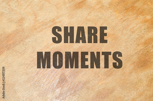 share momentson wooden background